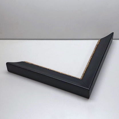 Aris - black frame with golden seeds ornament, pearl white mat
